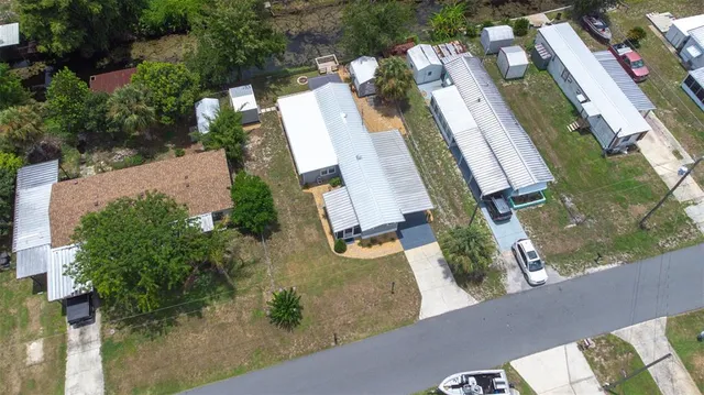 an aerial view of residential houses with outdoor space