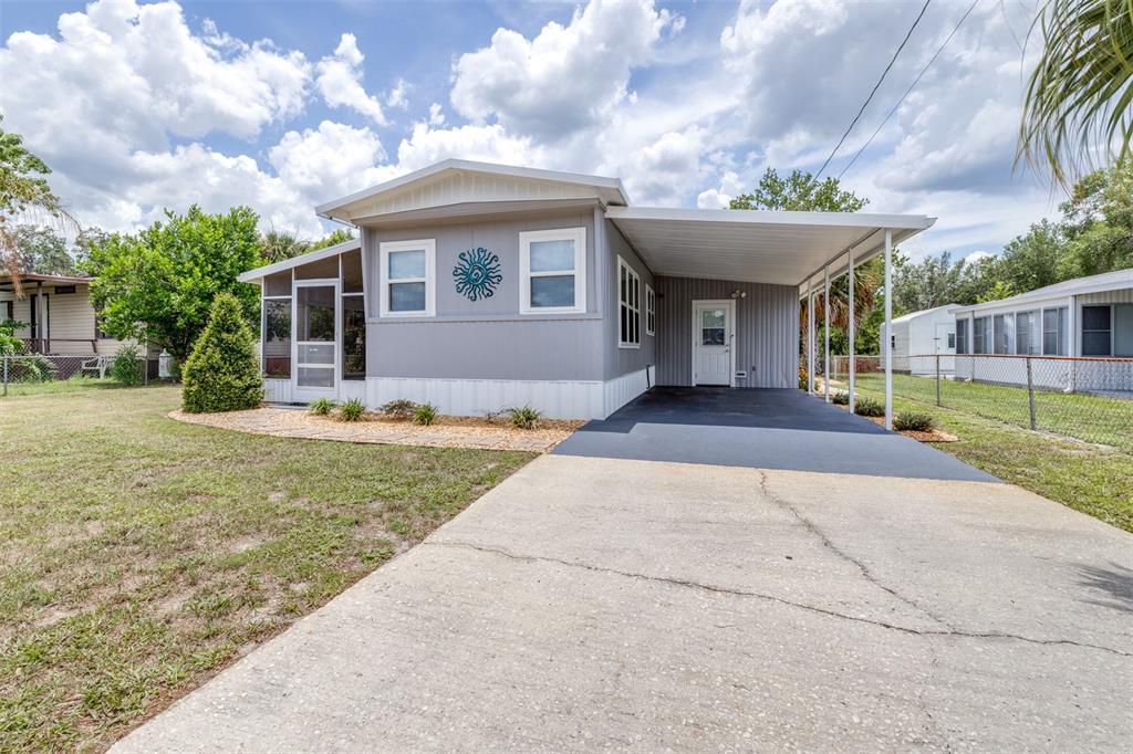 9936 East Perch Court Inverness, FL 34450 - Photo 8 of 30 a front view of a house with a garden and plants