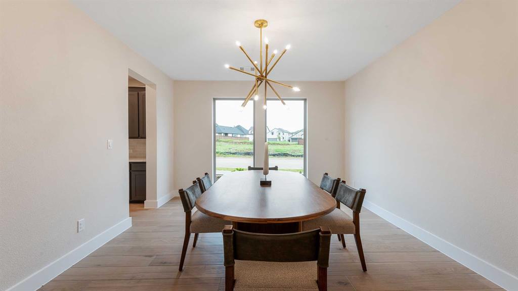 854 Stoney Bridge Way Lavon, TX 75166 - Photo 9 of 36 a dining room with furniture and window