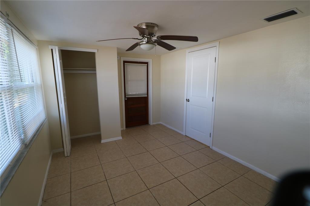 7825 Birchwood Drive Port Richey, FL 34668 - Photo 36 of 43 a view of empty room with a ceiling fan