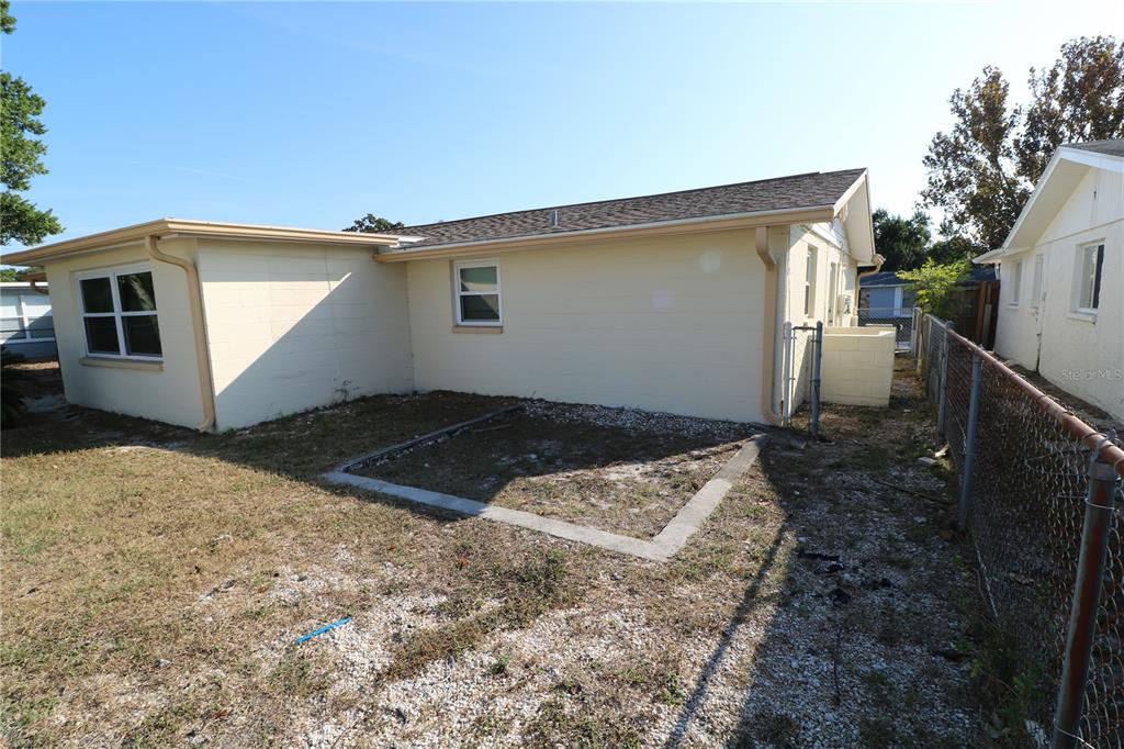 7825 Birchwood Drive Port Richey, FL 34668 - Photo 42 of 43 a view of a house with backyard