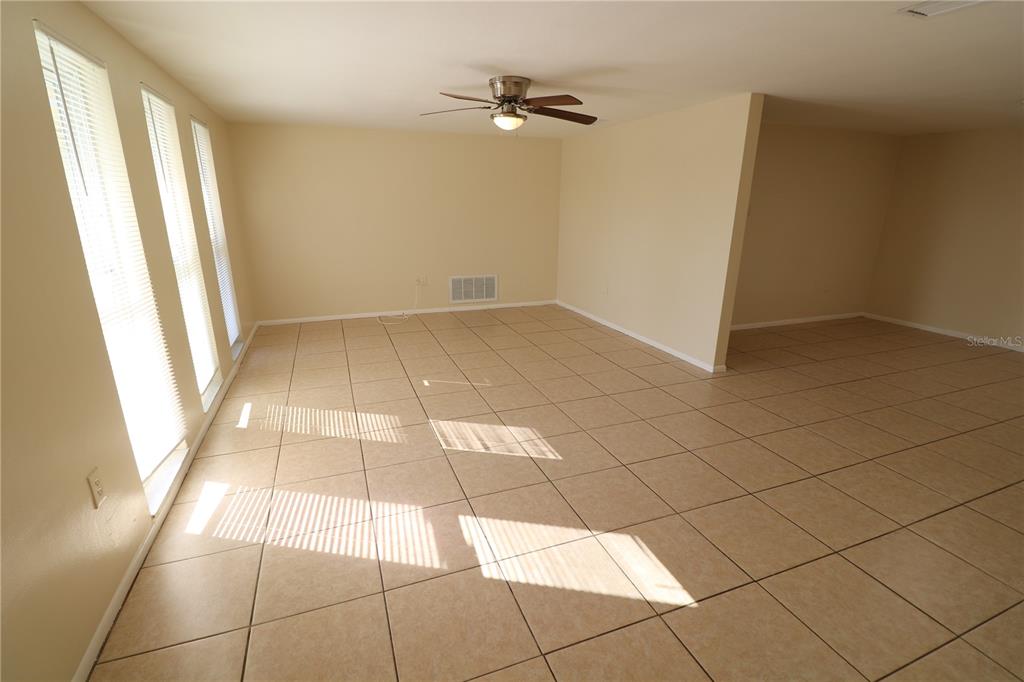 7825 Birchwood Drive Port Richey, FL 34668 - Photo 10 of 43 a view of an empty room and a window
