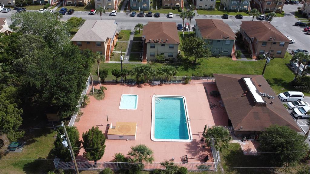 725 Michigan Court, Unit 3 St. Cloud, FL 34769 - Photo 12 of 12 an aerial view of a house with garden space and street view