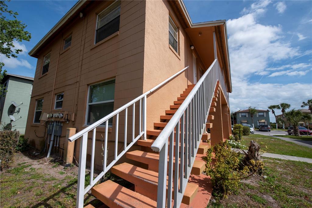 725 Michigan Court, Unit 3 St. Cloud, FL 34769 - Photo 9 of 12 a view of a house with a yard