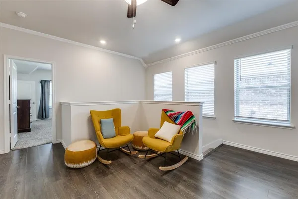 a living room with furniture and white walls