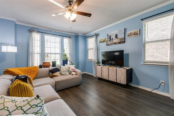 a living room with furniture and a flat screen tv