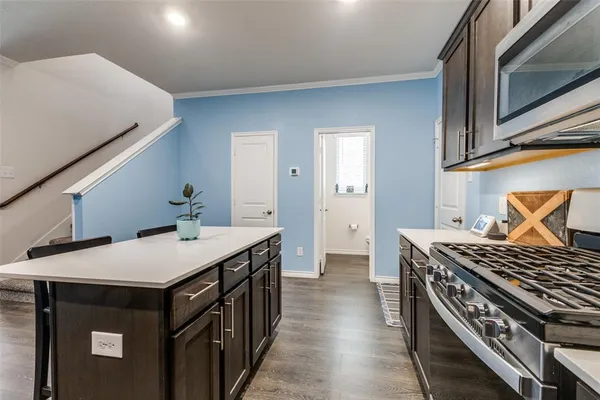 a kitchen that has a sink and a stove