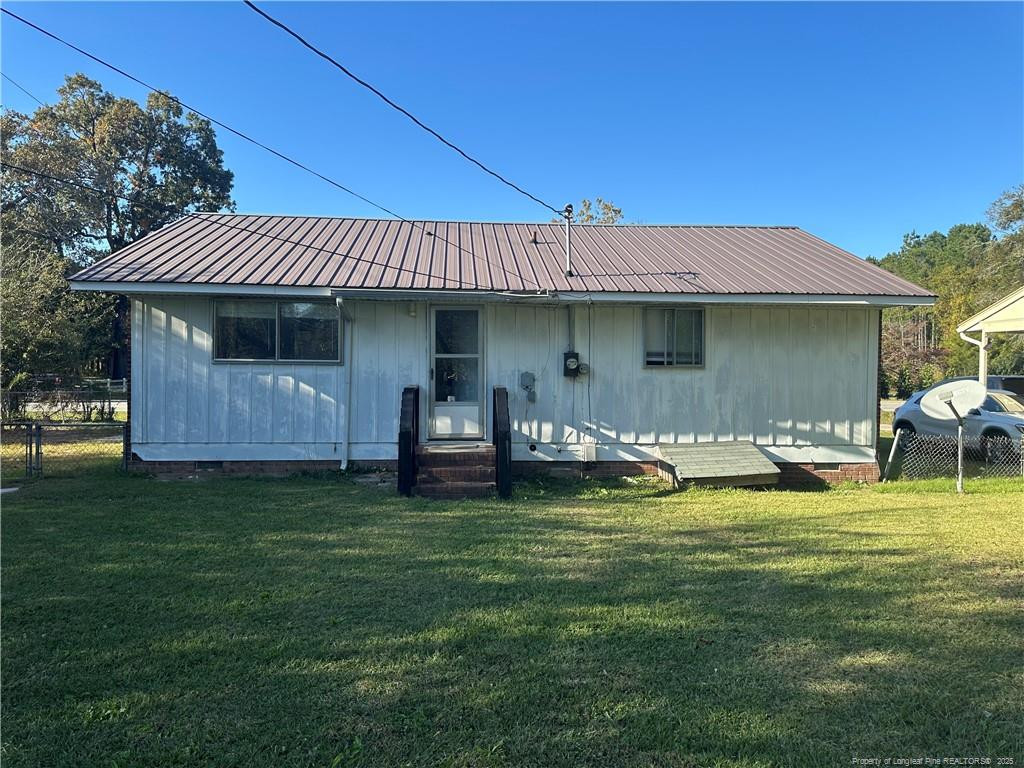 1224 East Manchester Road Spring Lake, NC 28390 - Photo 12 of 12 a backyard of a house with table and chairs