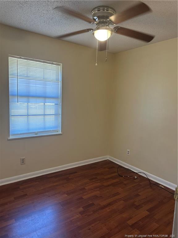 1224 East Manchester Road Spring Lake, NC 28390 - Photo 7 of 12 wooden floor in an empty room with a window