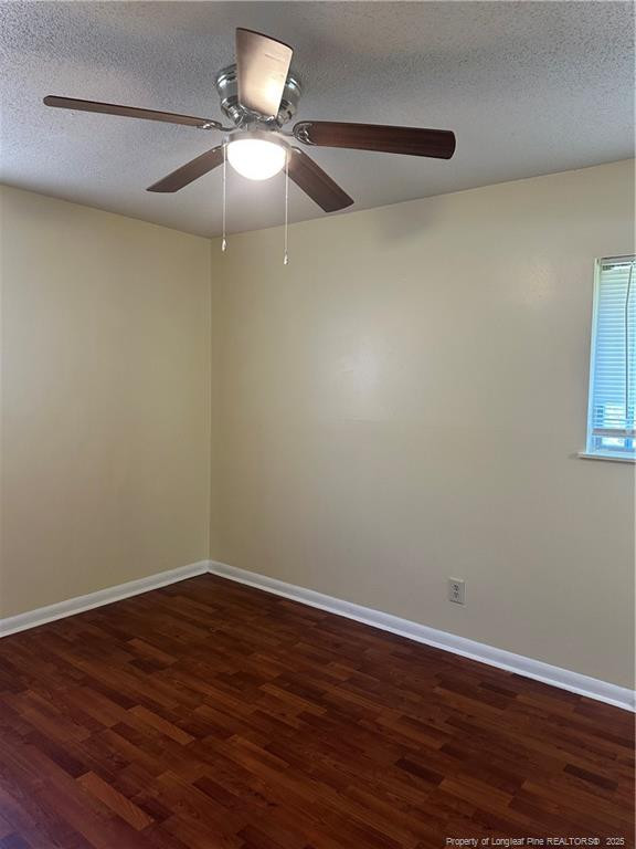 1224 East Manchester Road Spring Lake, NC 28390 - Photo 9 of 12 a view of a room with wooden floor and a ceiling fan