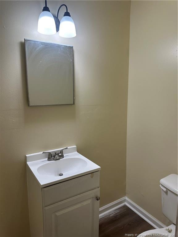 1224 East Manchester Road Spring Lake, NC 28390 - Photo 10 of 12 a bathroom with a sink and a mirror