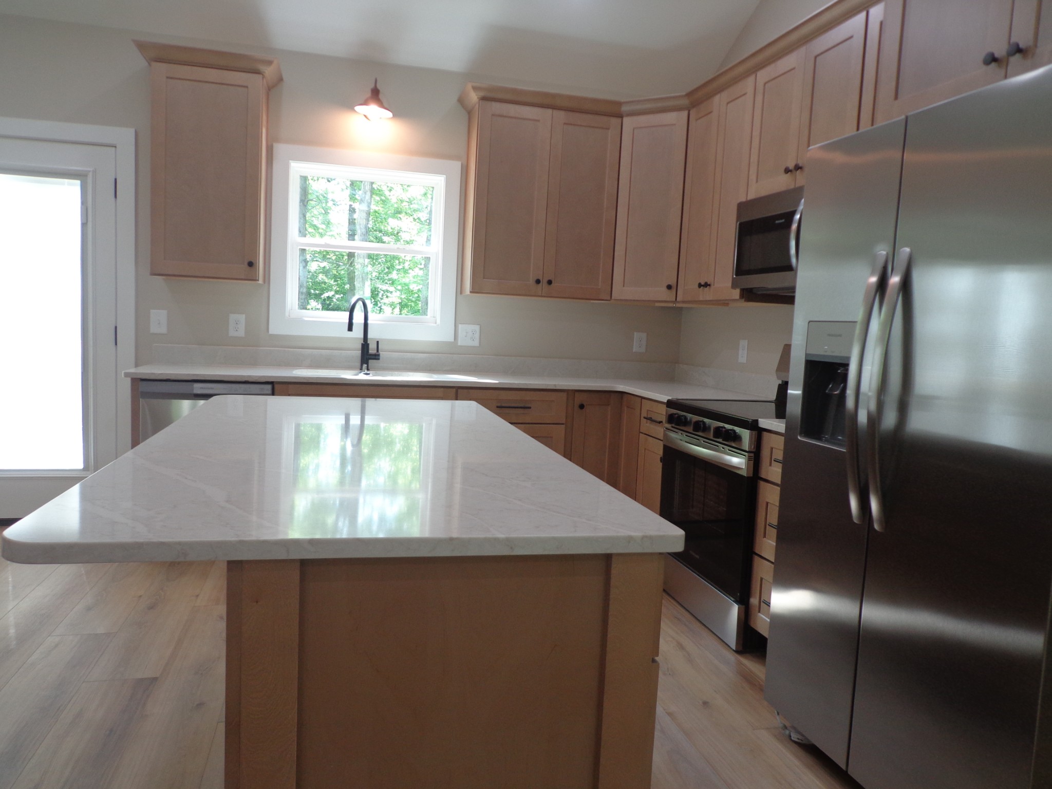 700 Hillcrest Road Waverly, TN 37185 - Photo 15 of 49 a kitchen with stainless steel appliances granite countertop a sink a stove and a refrigerator
