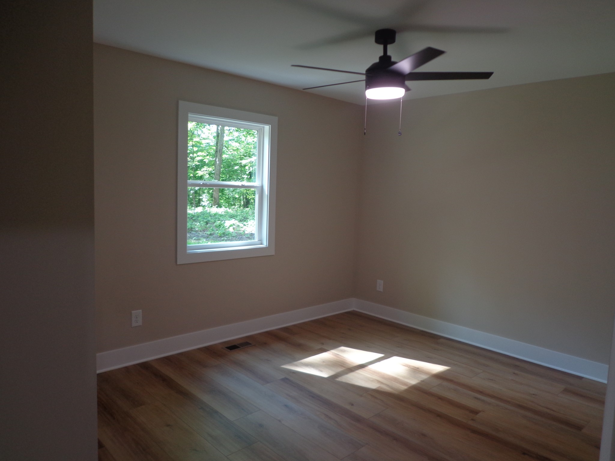 700 Hillcrest Road Waverly, TN 37185 - Photo 18 of 49 wooden floor in an empty room with a window