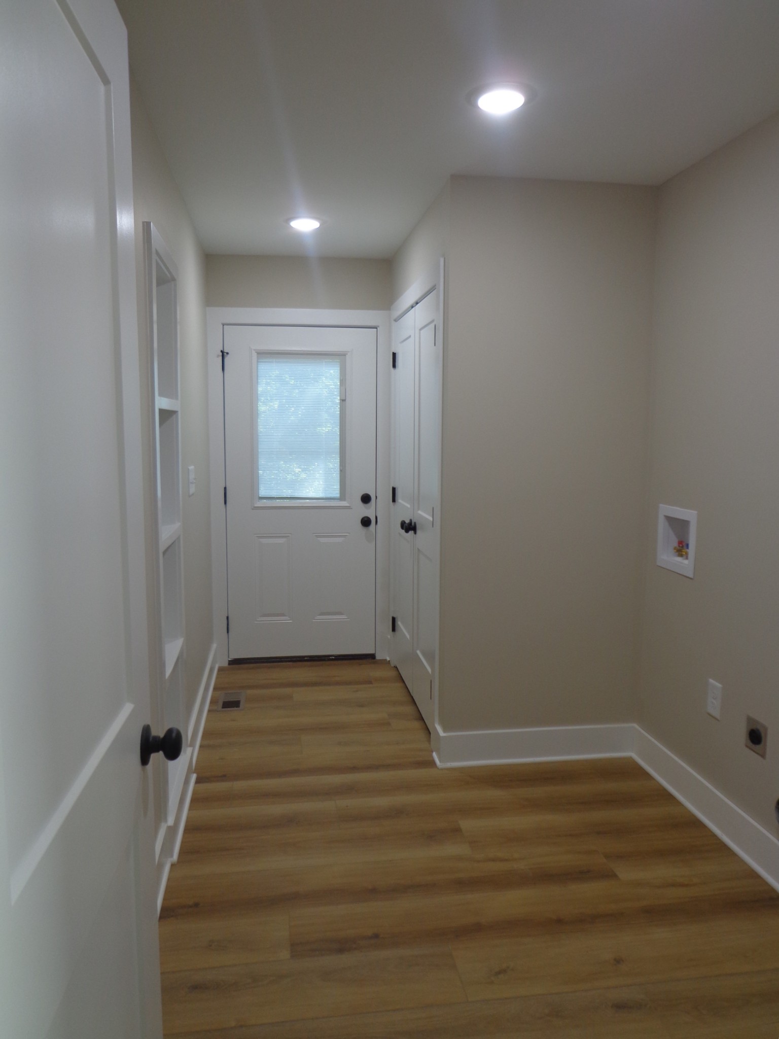 700 Hillcrest Road Waverly, TN 37185 - Photo 22 of 49 a view of an empty room with wooden floor and a window