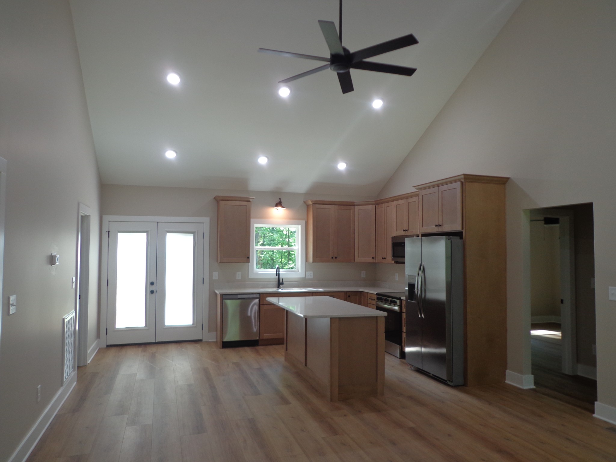 700 Hillcrest Road Waverly, TN 37185 - Photo 10 of 49 a kitchen with stainless steel appliances a refrigerator and wooden floor