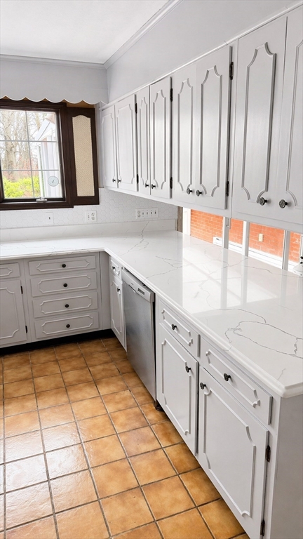 12 Woodland Road Westfield, MA 01085 - Photo 15 of 29 a kitchen with granite countertop white cabinets and window