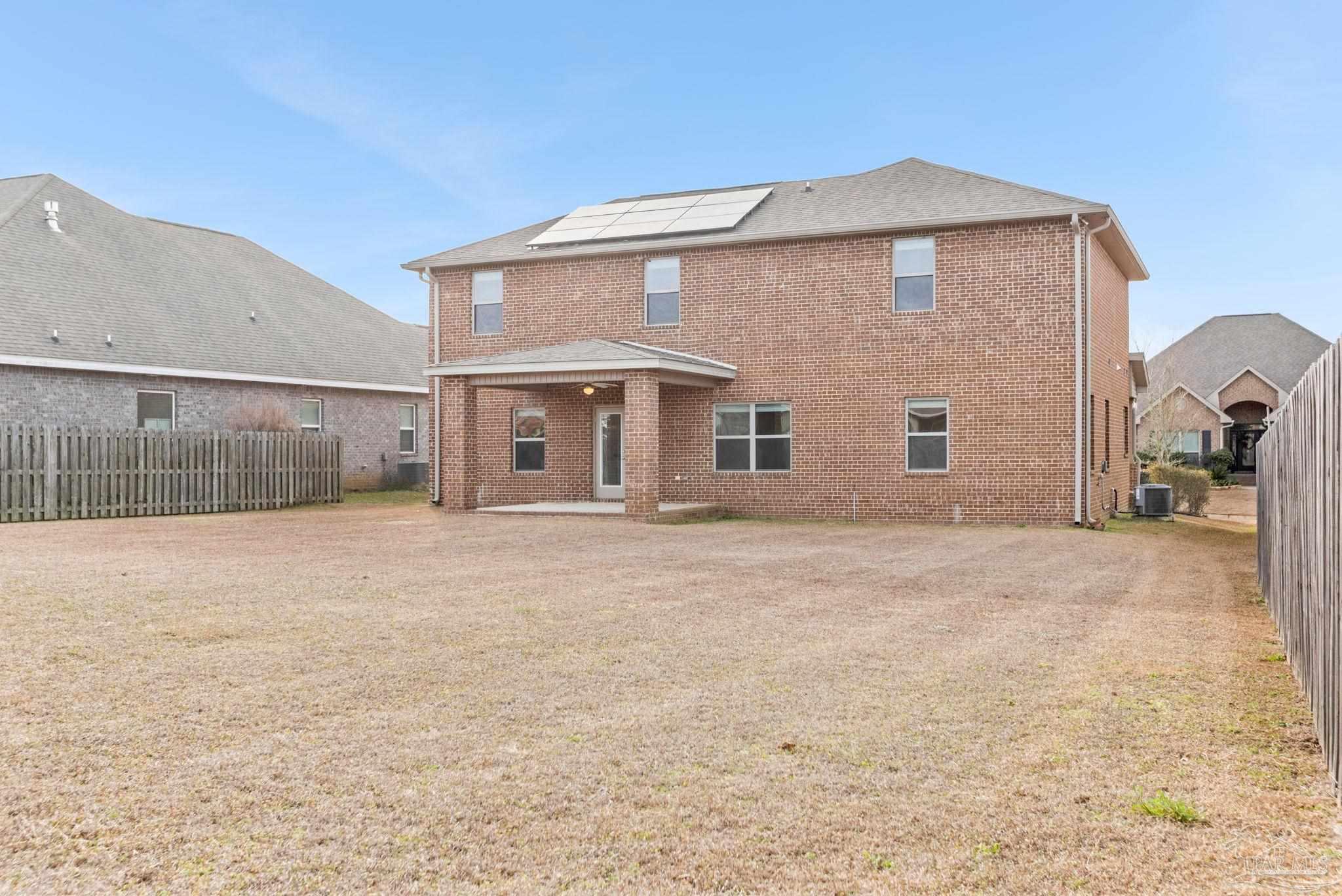 8016 Woodbrook Road Pensacola, FL 32526 - Photo 43 of 52 a view of a house with a backyard