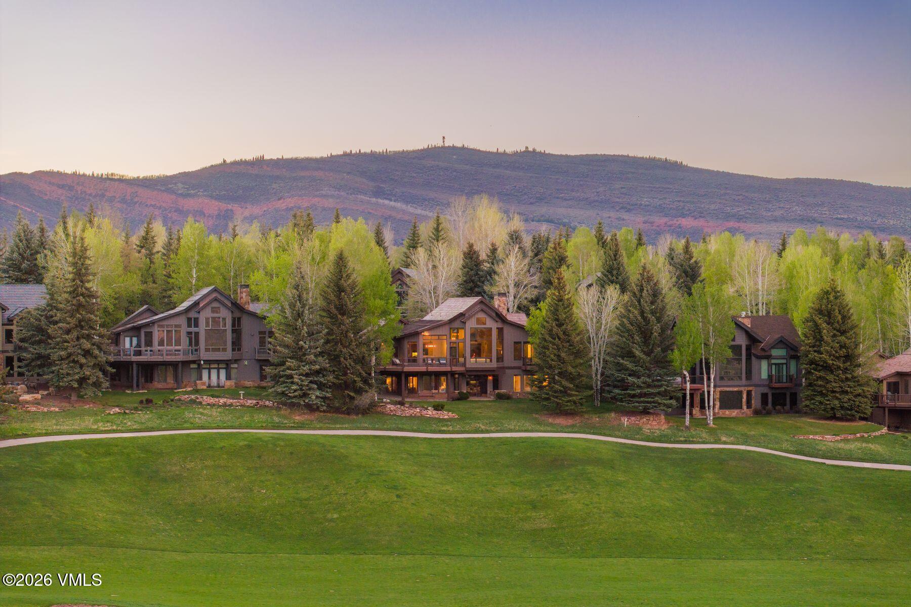 167 Saddle Ridge Edwards, CO 81632 - Photo 37 of 41 a view of a lush green hillside and a building