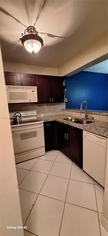 a bedroom with a bed and a stove