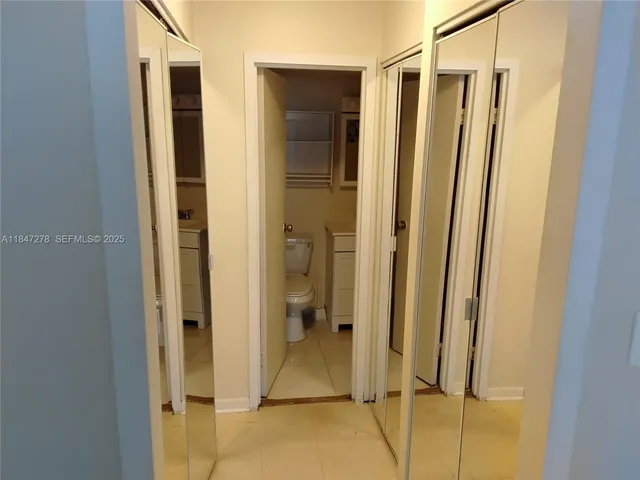 a kitchen with stainless steel appliances granite countertop a sink and a stove
