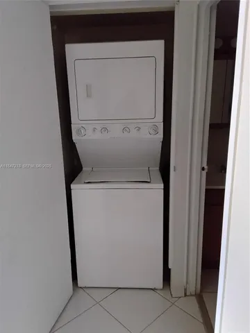 a kitchen with stainless steel appliances granite countertop a refrigerator and a granite counter tops