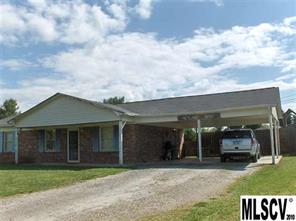 4050 Beach Road Hudson, NC 28638 - Photo 1 of 1 a front view of a house with a garden