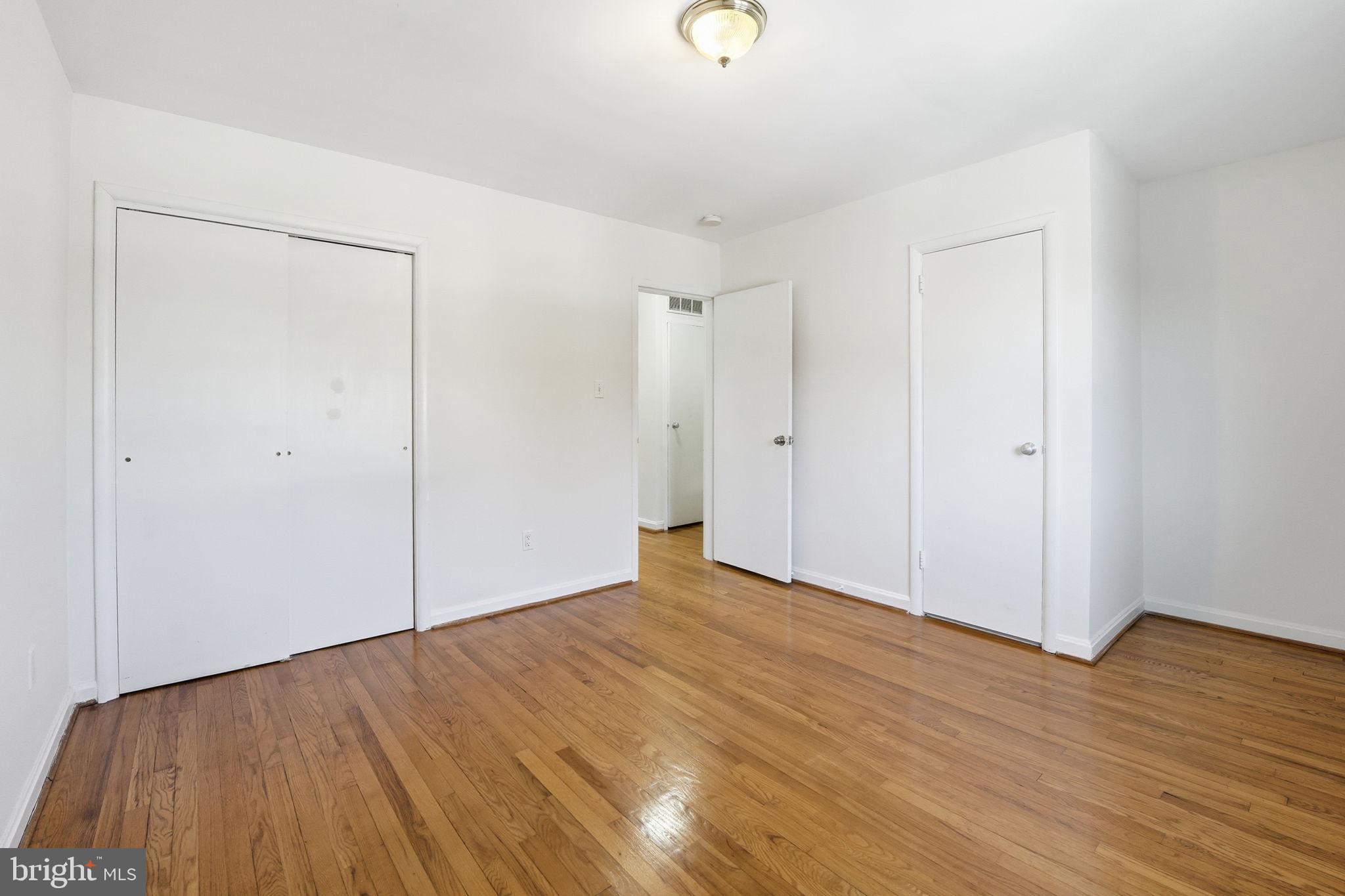 5364 Pooks Hill Road Bethesda, MD 20814 - Photo 12 of 25 a view of an empty room with wooden floor