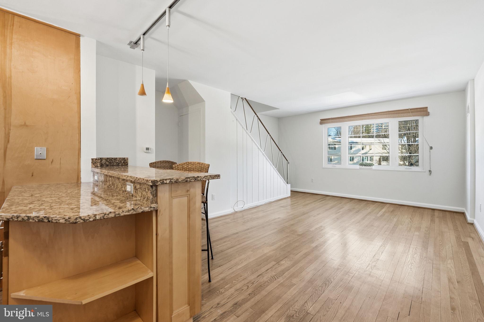 5364 Pooks Hill Road Bethesda, MD 20814 - Photo 3 of 25 a view of a room with wooden floor and window