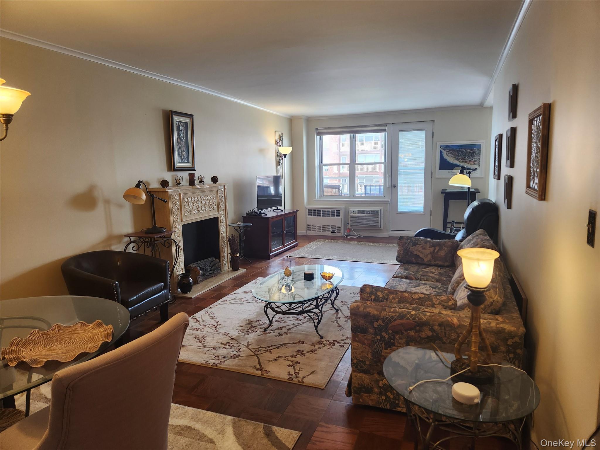 700 Shore Road, Unit 4K Long Beach, NY 11561 - Photo 3 of 31 a living room with furniture and wooden floor