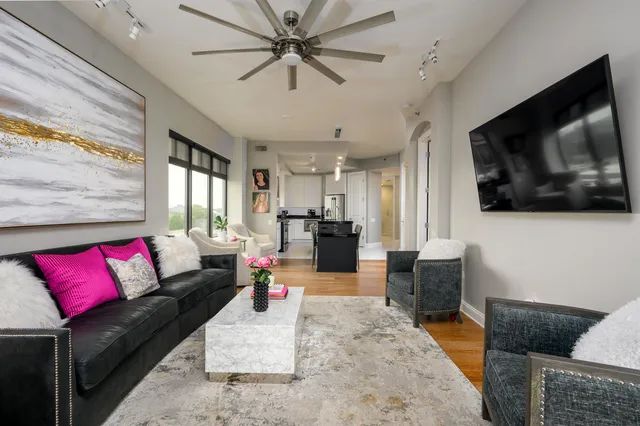 a living room with furniture and a flat screen tv
