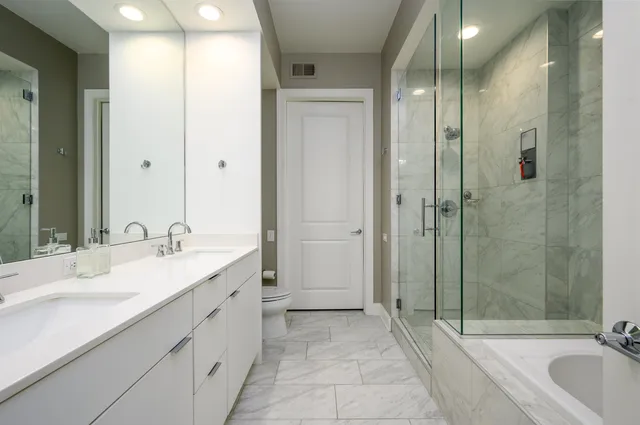 a bathroom with a double vanity sink and a mirror