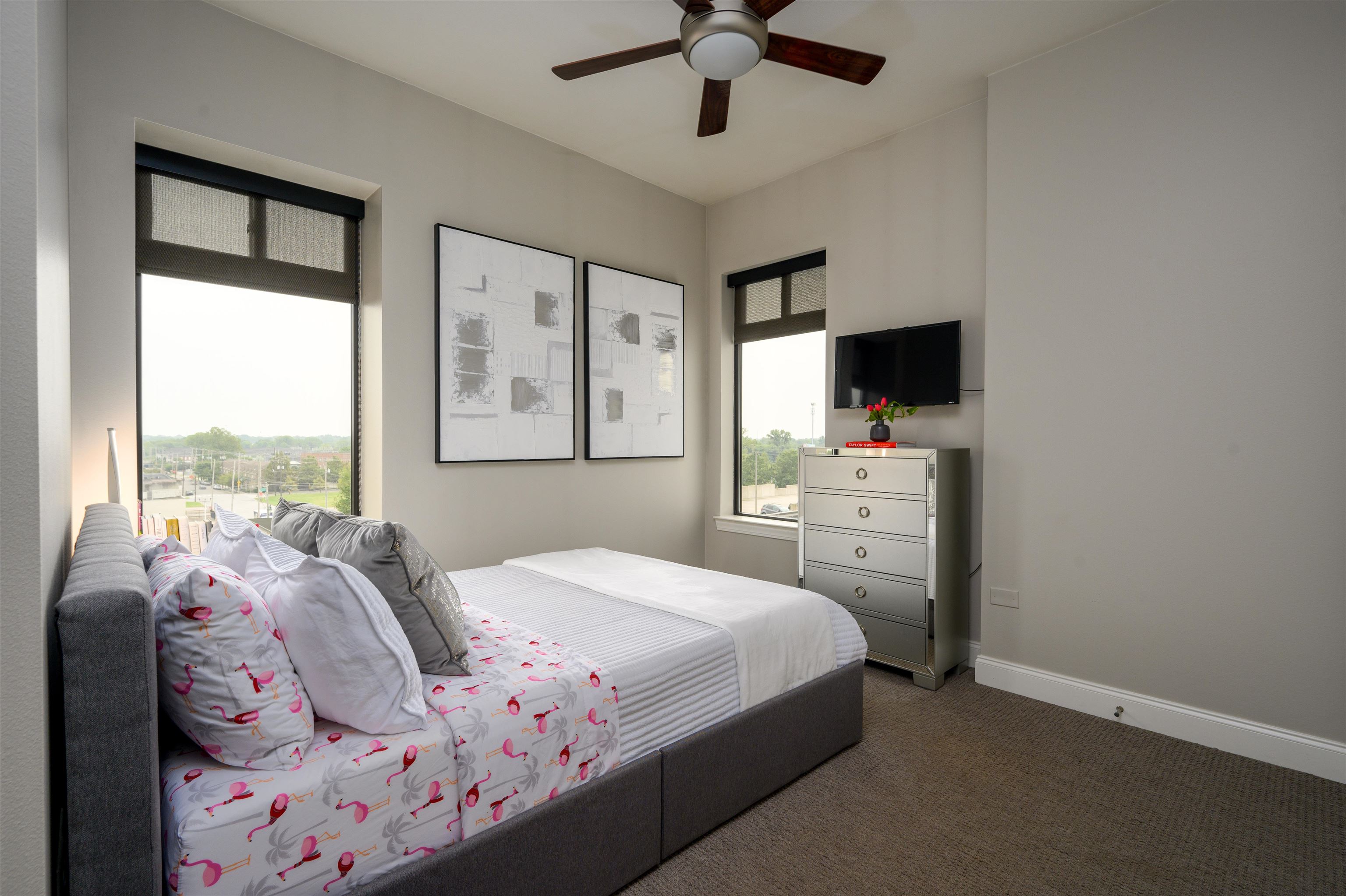 717 Riverside Drive, Unit 510 Memphis, TN 38103 - Photo 14 of 34 a bedroom with a bed dresser and a window