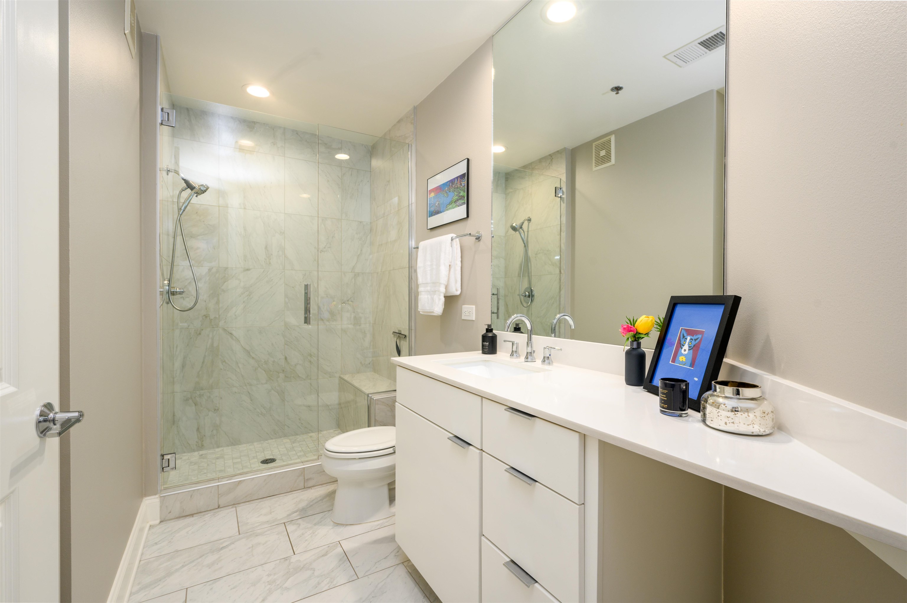 717 Riverside Drive, Unit 510 Memphis, TN 38103 - Photo 15 of 34 a bathroom with a sink a toilet and shower