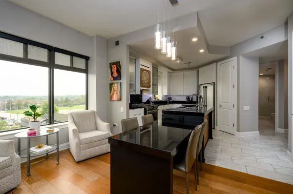 a living room with furniture and a large window