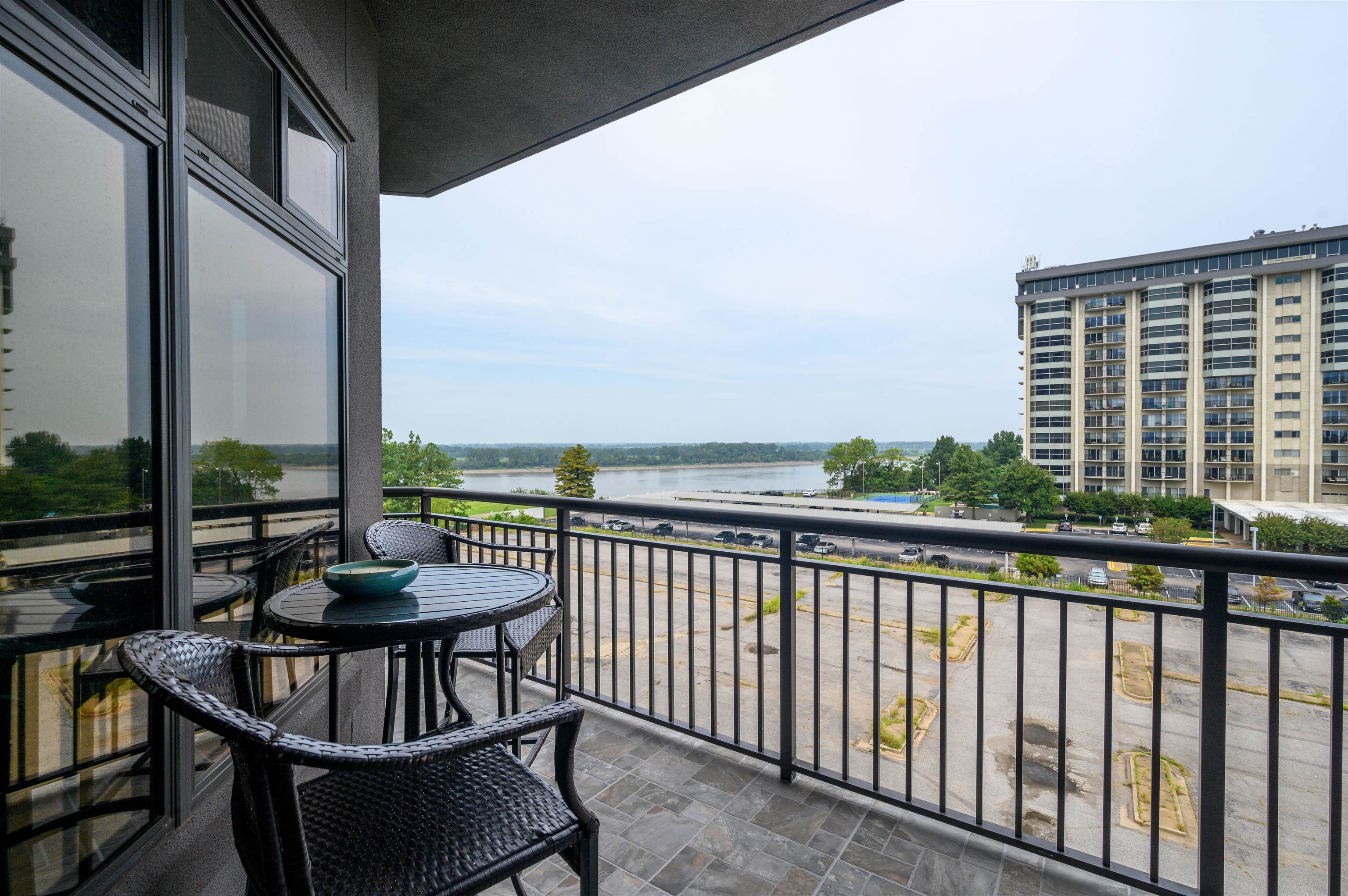 717 Riverside Drive, Unit 510 Memphis, TN 38103 - Photo 8 of 34 a view of balcony with couch and chairs