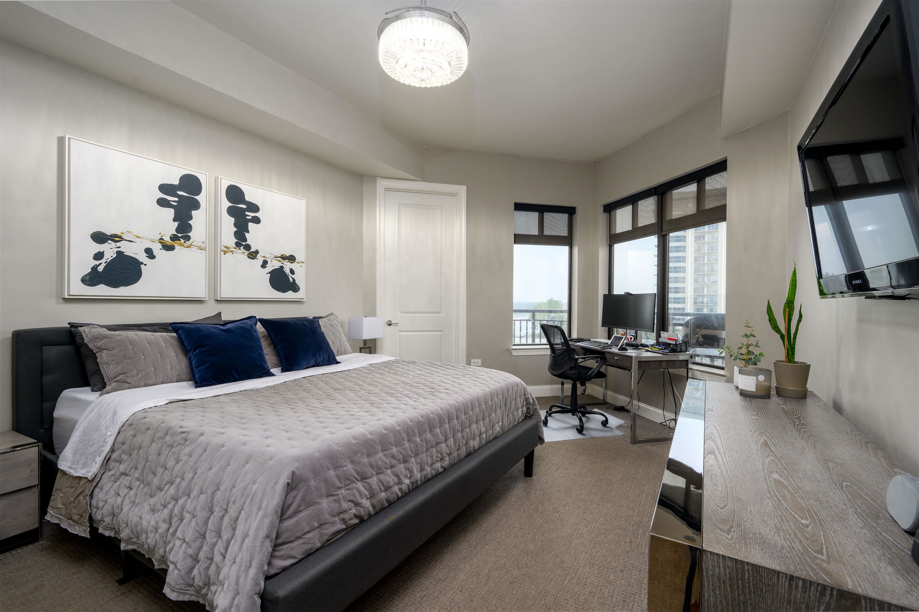 717 Riverside Drive, Unit 510 Memphis, TN 38103 - Photo 10 of 34 a bed room with a bed and a chair