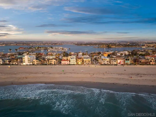 a view of an entryway with a flower pot and a bookshelf