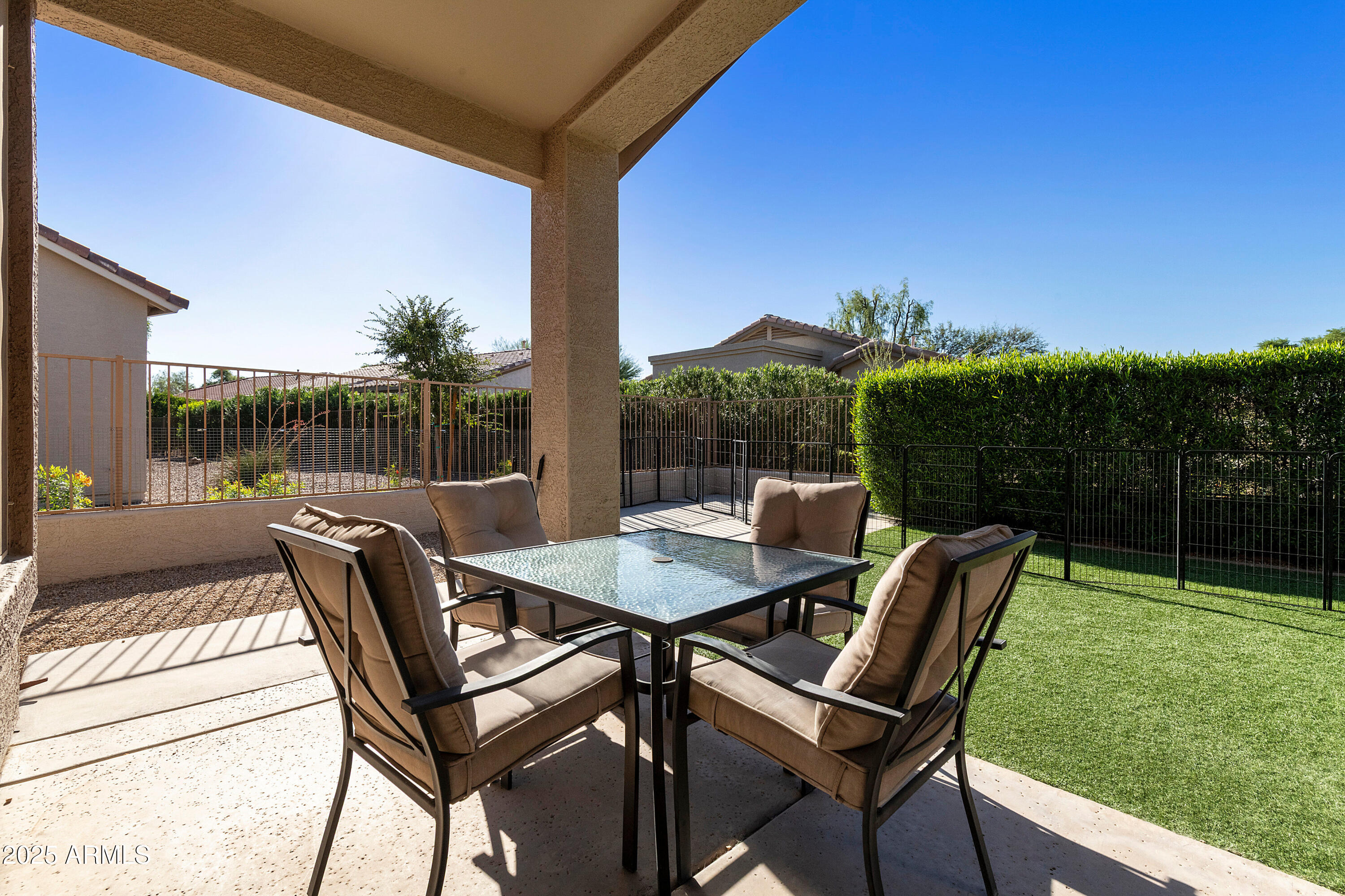 4727 East Azalea Drive Gilbert, AZ 85298 - Photo 22 of 46 a view of a chairs and table in patio with a backyard
