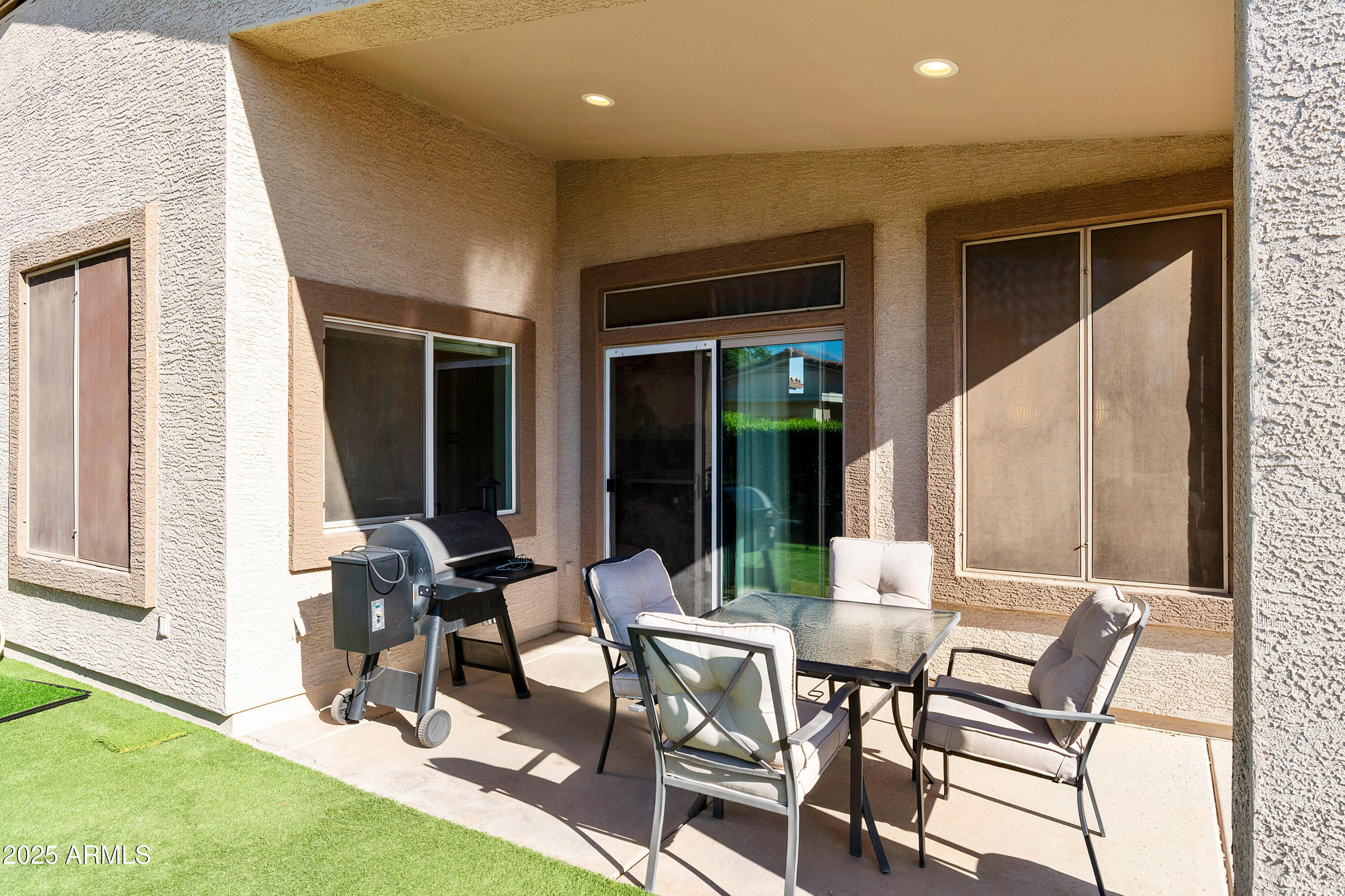 4727 East Azalea Drive Gilbert, AZ 85298 - Photo 25 of 46 a view of a patio with table and chairs and potted plants