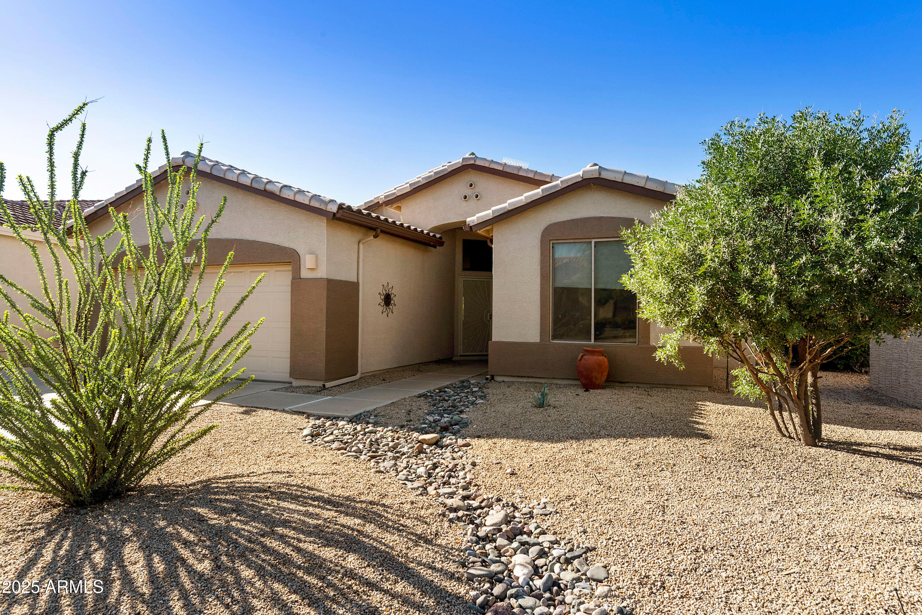 4727 East Azalea Drive Gilbert, AZ 85298 - Photo 3 of 46 a front view of a house with a yard and garage