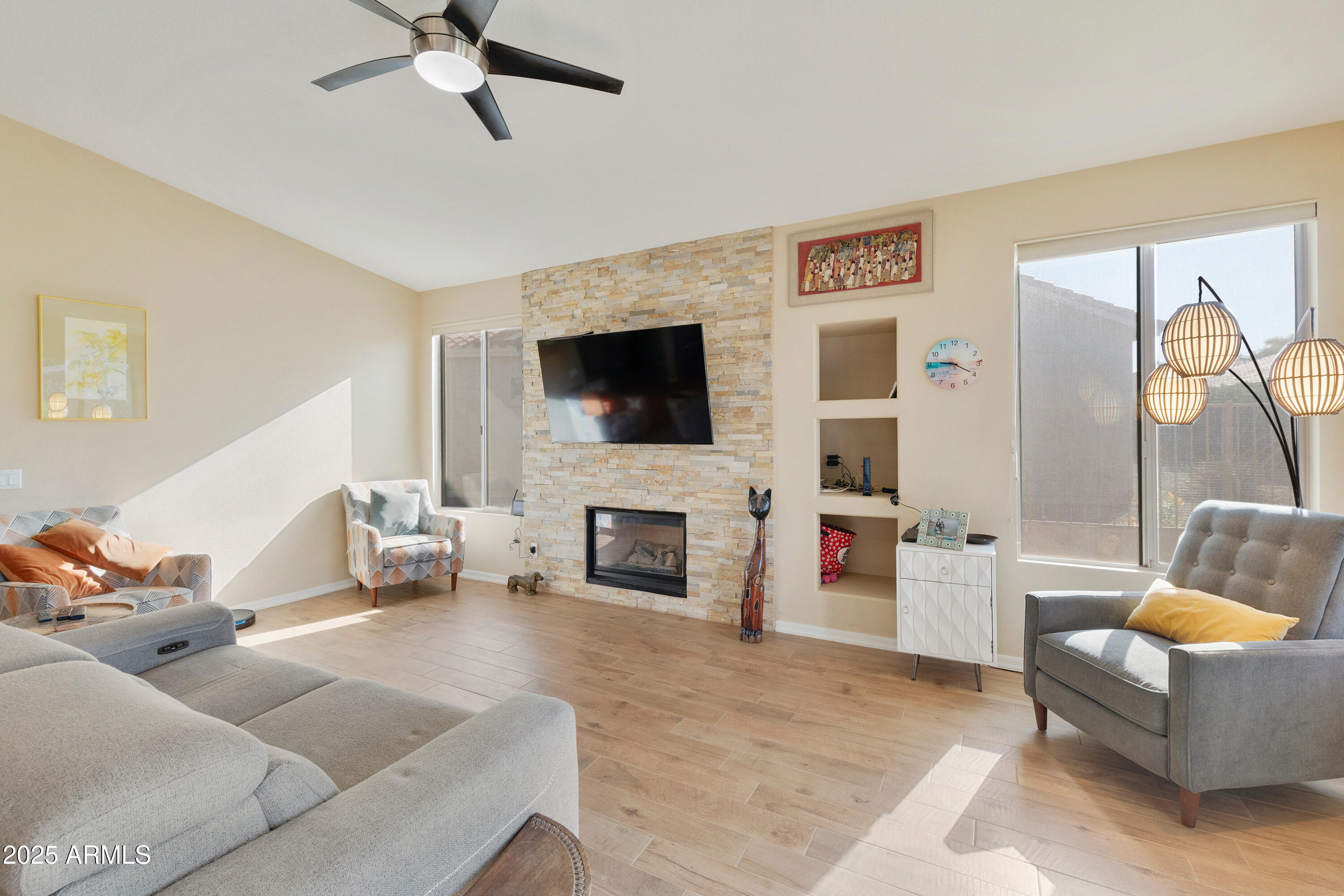 4727 East Azalea Drive Gilbert, AZ 85298 - Photo 7 of 46 a living room with furniture and a fireplace