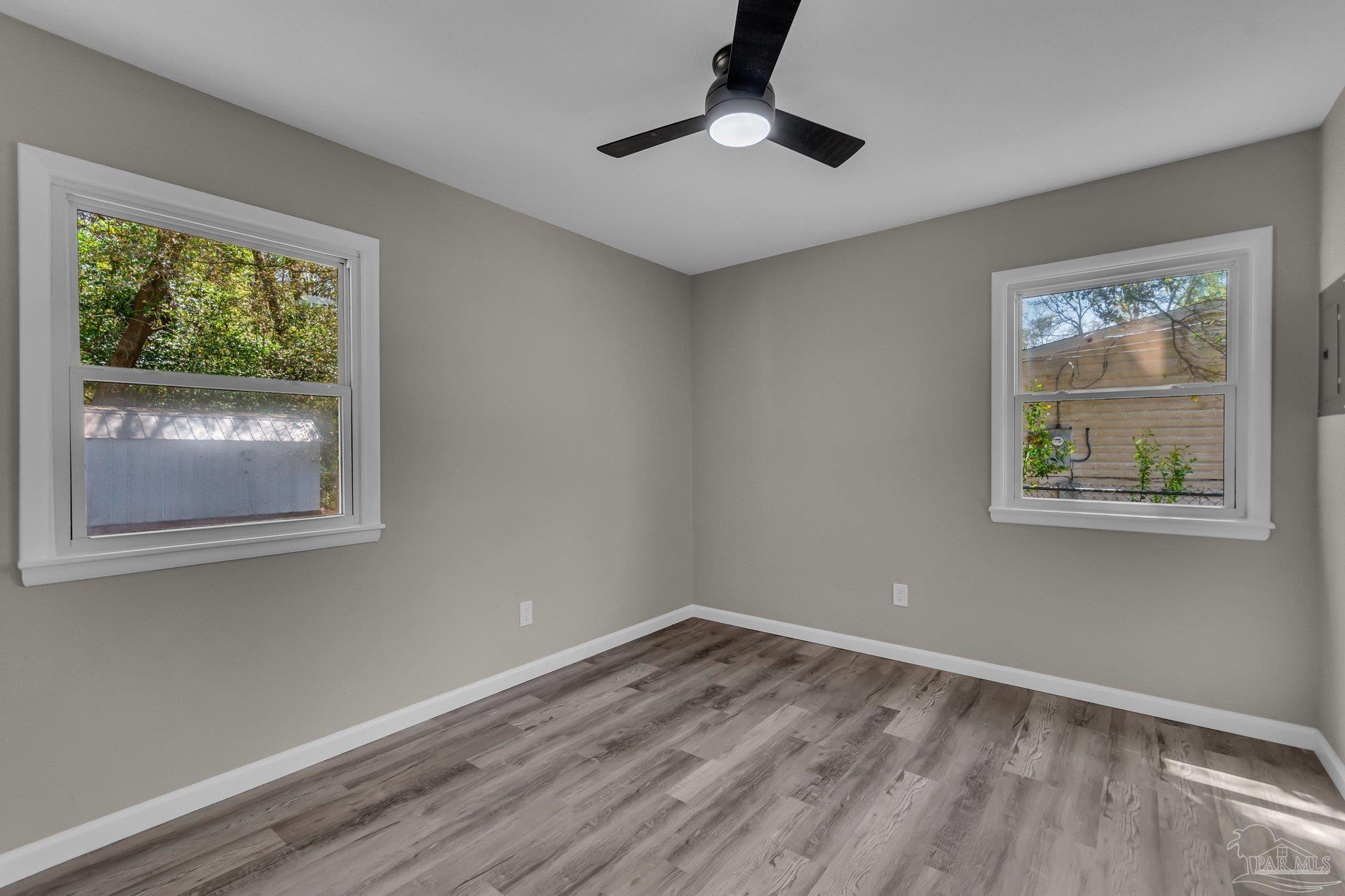 5636 Avondale Road Pensacola, FL 32526 - Photo 16 of 22 a view of empty room with wooden floor and window