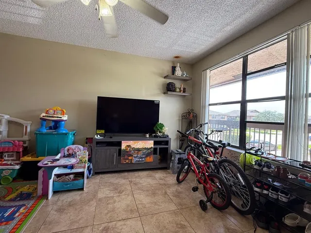 a view of a balcony with wooden floor