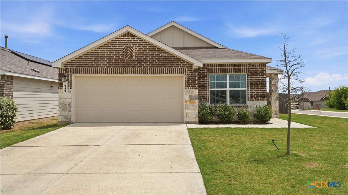 1949 Redstart New Braunfels, TX 78130 - Photo 2 of 32 a front view of a house with a yard