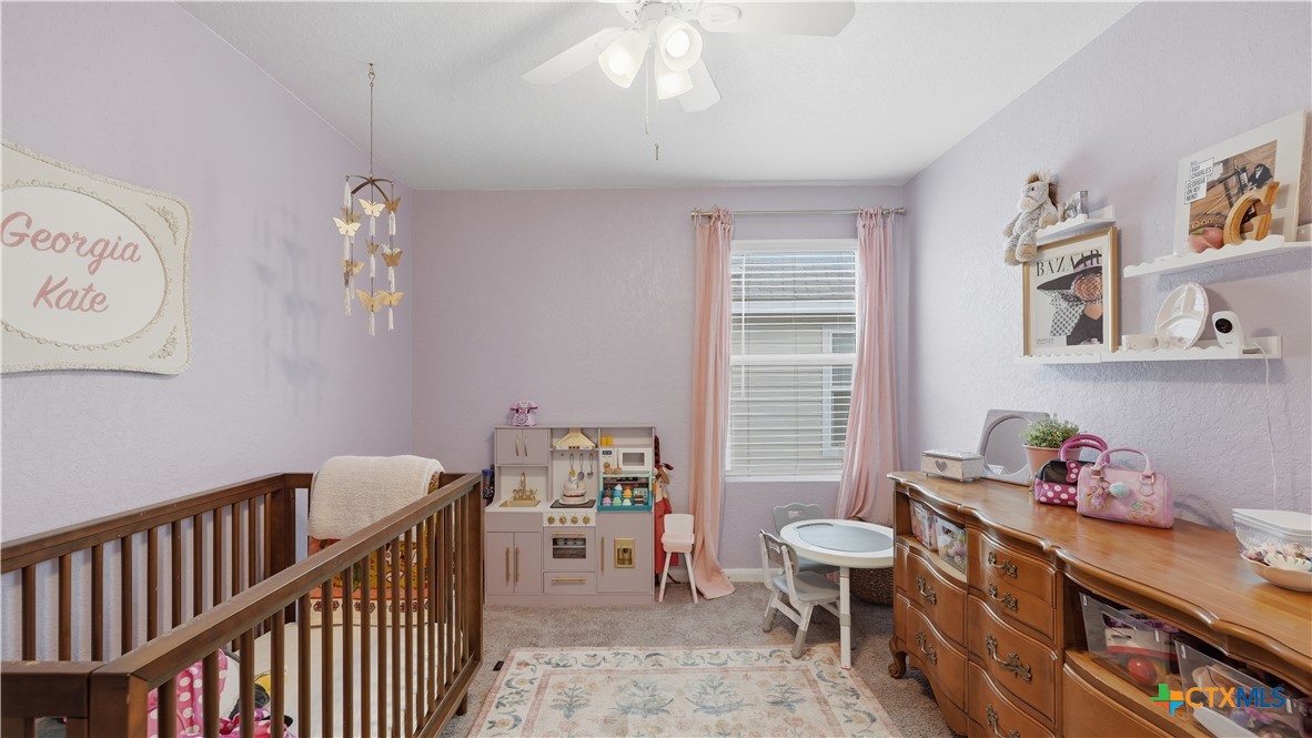 1949 Redstart New Braunfels, TX 78130 - Photo 21 of 32 a bedroom with furniture and a window