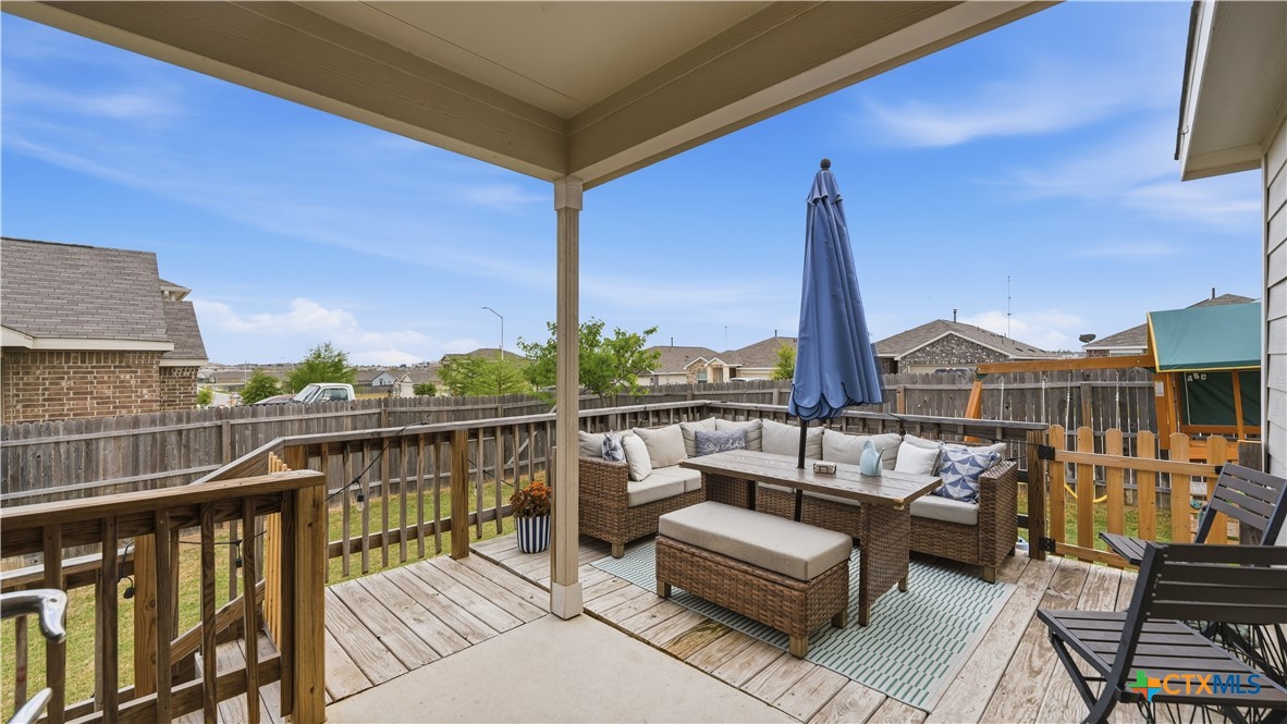 1949 Redstart New Braunfels, TX 78130 - Photo 25 of 32 a view of a balcony with couches and wooden floor