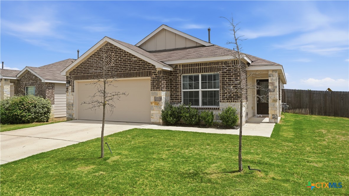 1949 Redstart New Braunfels, TX 78130 - Photo 3 of 32 a front view of a house with a yard