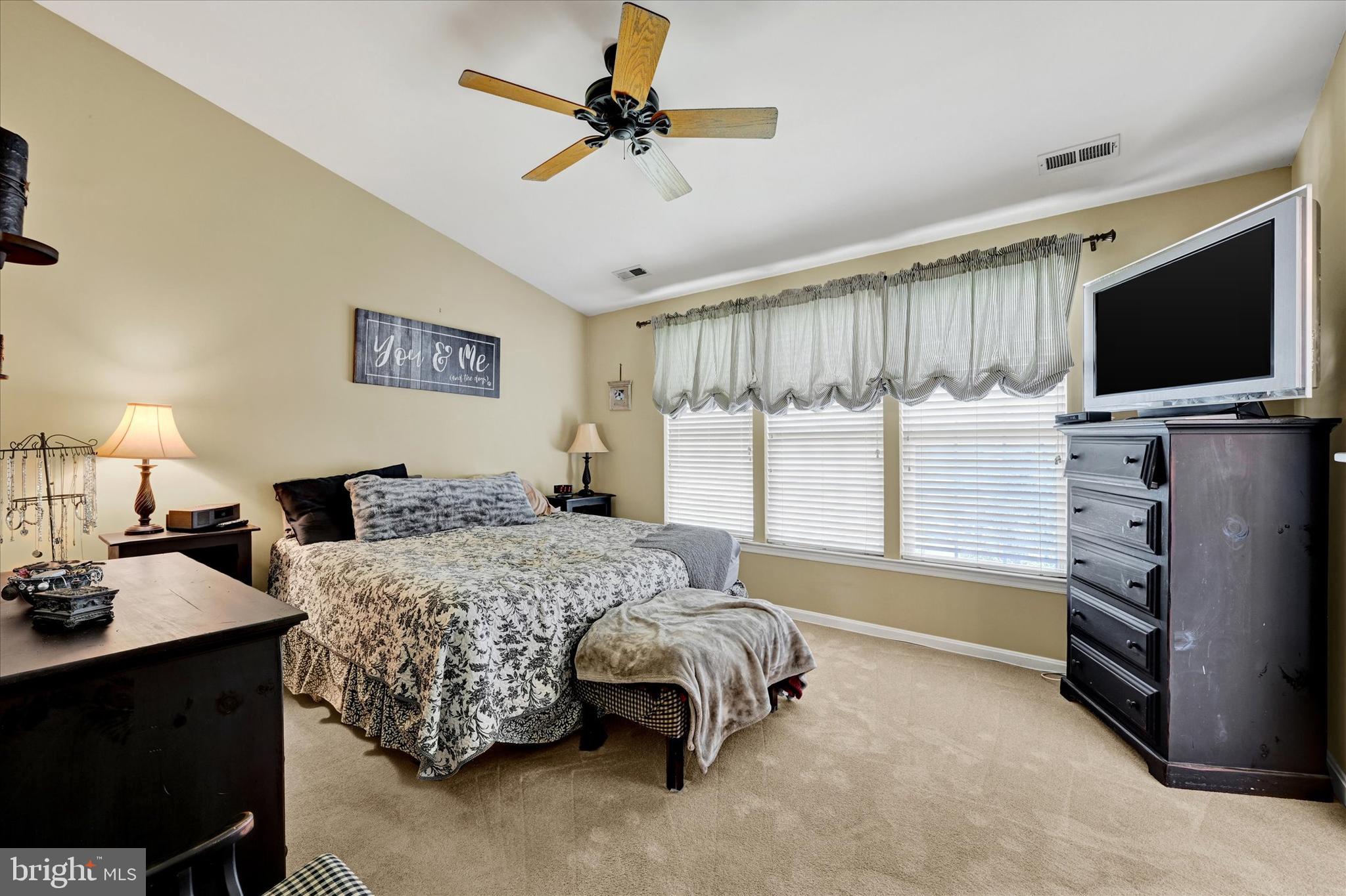4642 Bucks School House Road Rosedale, MD 21237 - Photo 19 of 33 a bedroom with a bed and a flat screen tv