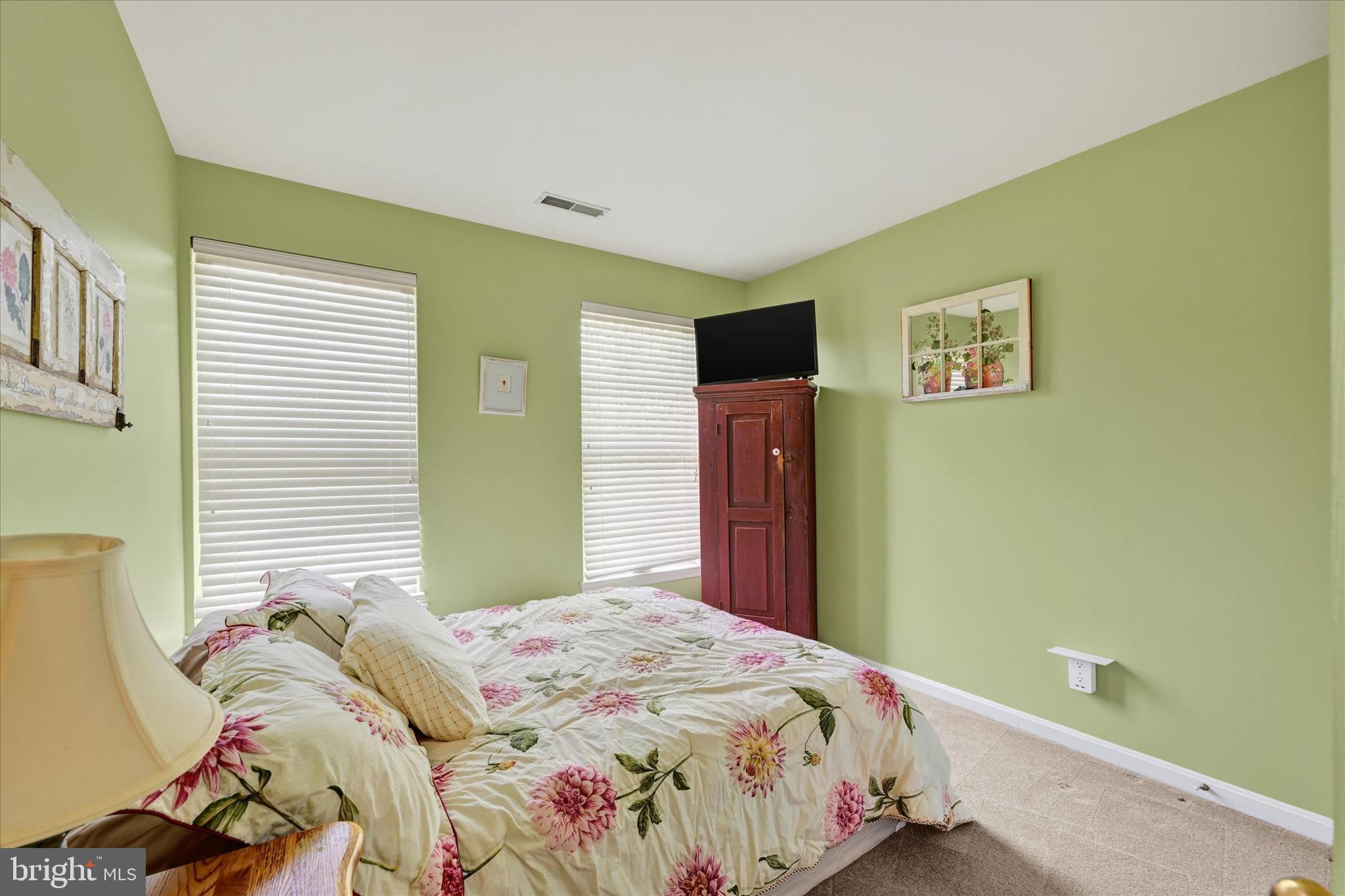 4642 Bucks School House Road Rosedale, MD 21237 - Photo 23 of 33 a bedroom with a bed and a window
