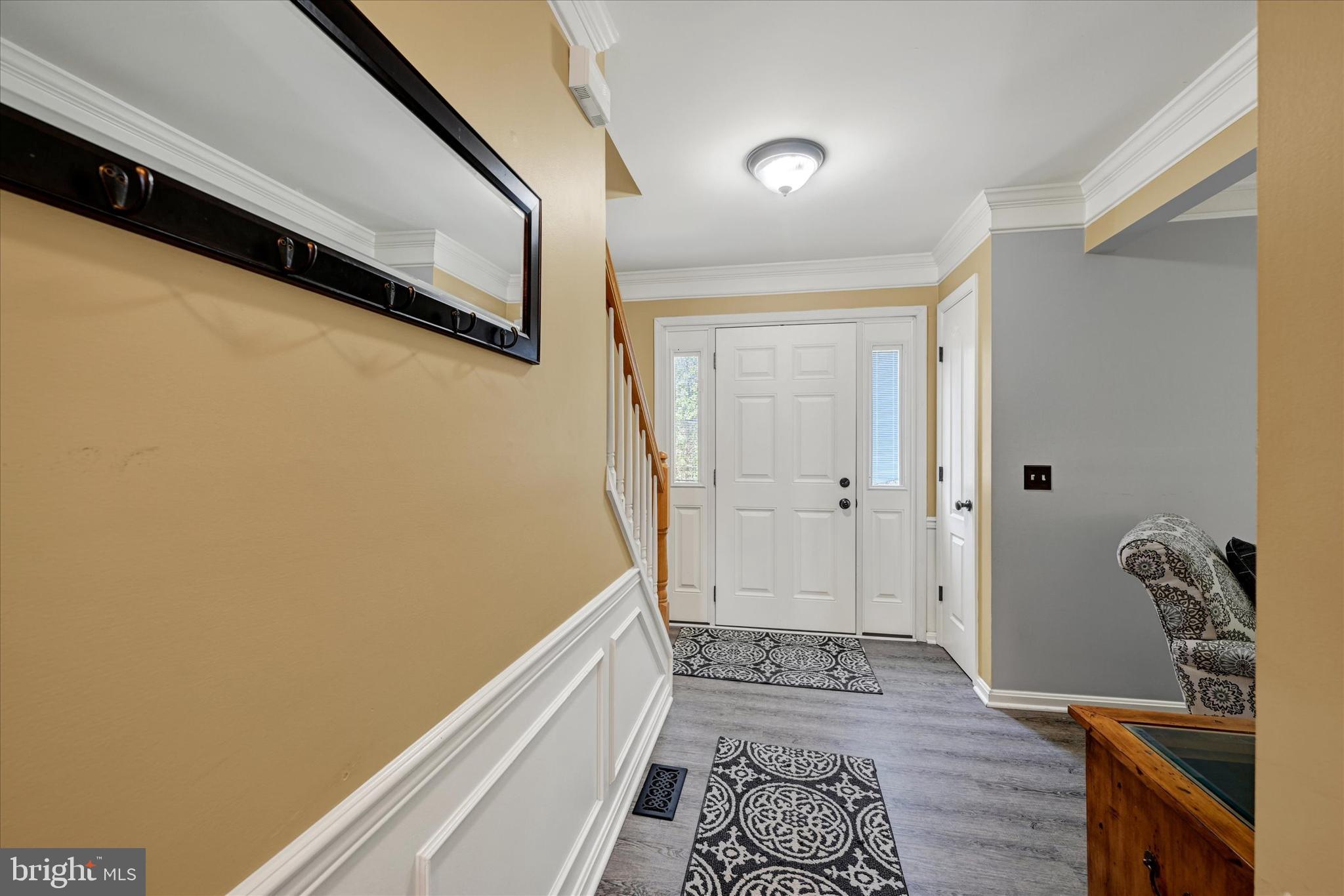 4642 Bucks School House Road Rosedale, MD 21237 - Photo 5 of 33 a view of a hallway with wooden floor and a bathroom